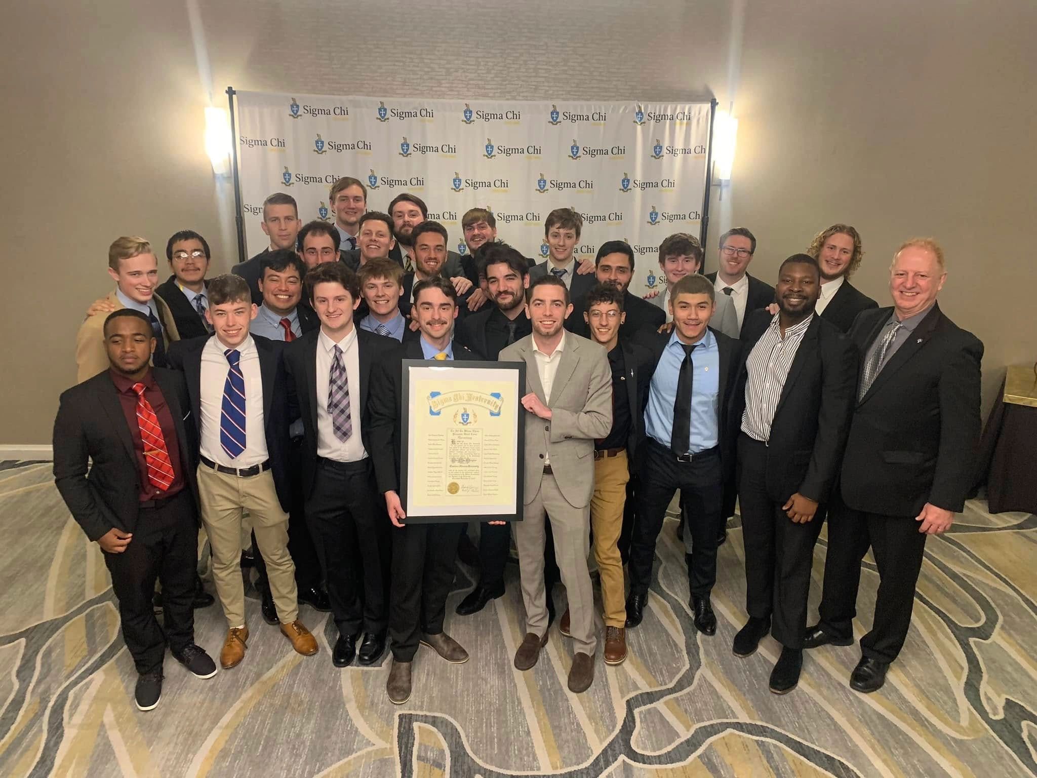 Eta Mu brothers celebrating the chapter reinstallation banquet